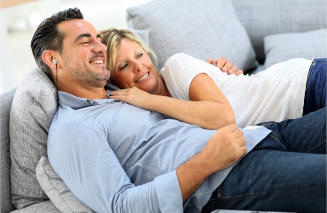 Couple using TV Voice Pro Air on the Couch